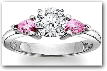 Three stone diamond and pink sapphire engagement ring